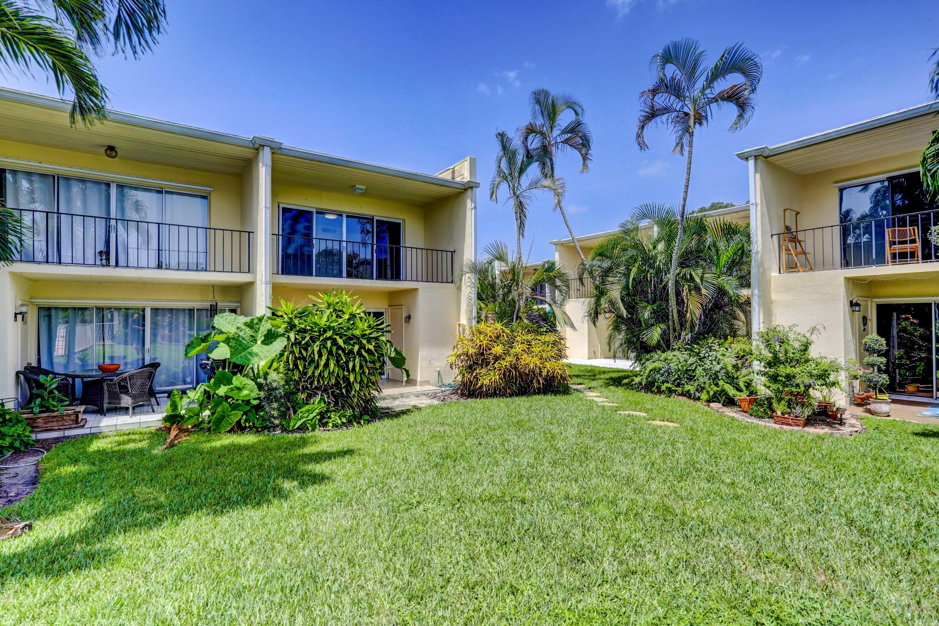 394 Golfview Road, Unit F North Palm Beach, FL 33408 - Photo 45 of 73 a view of a house with a garden