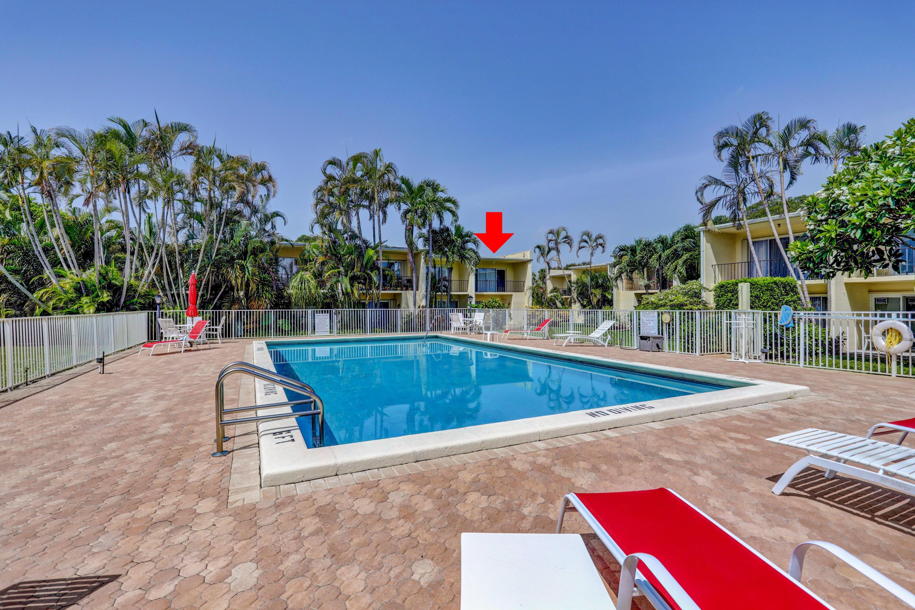 394 Golfview Road, Unit F North Palm Beach, FL 33408 - Photo 46 of 73 a view of a swimming pool with a patio