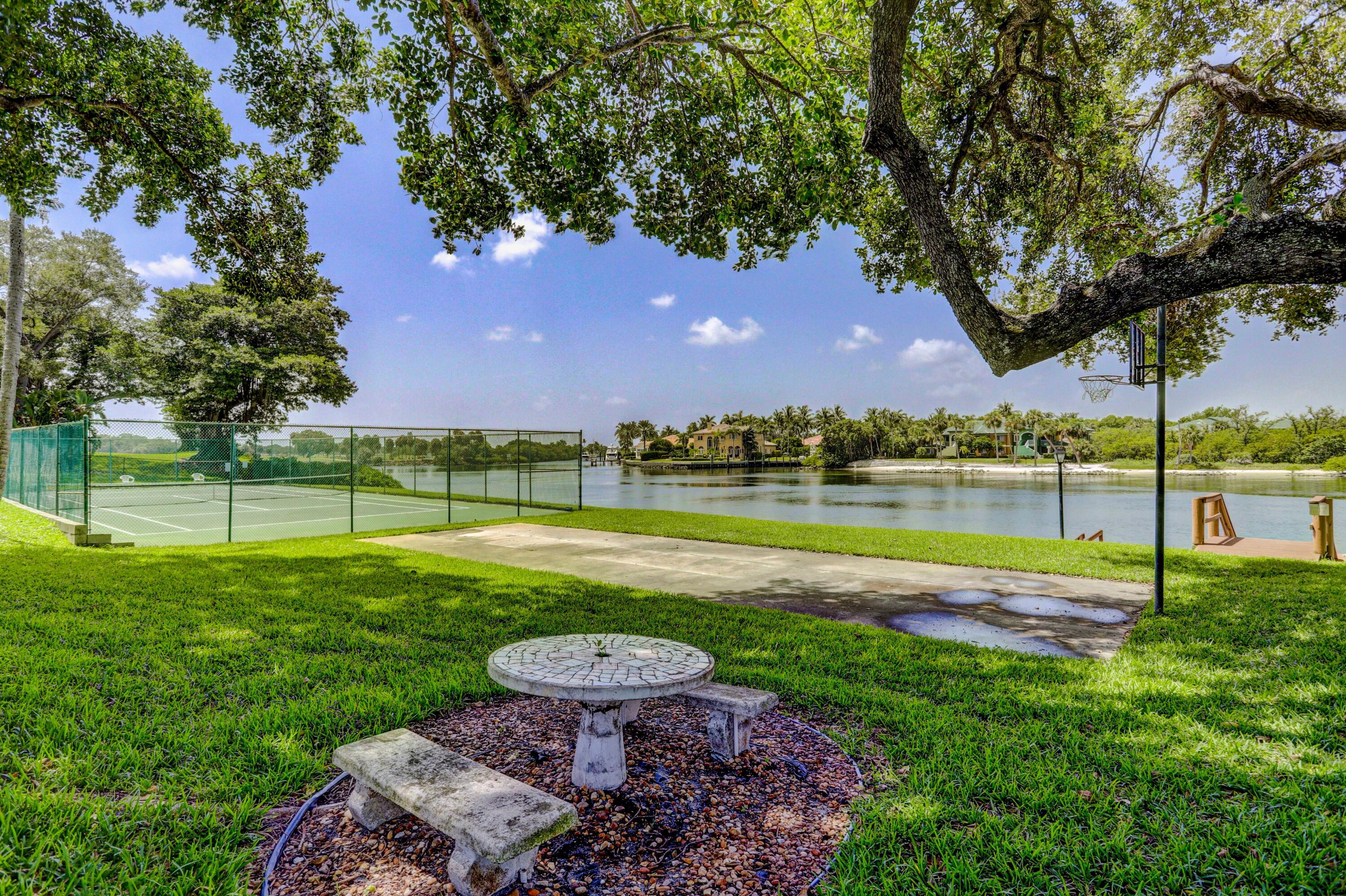 394 Golfview Road, Unit F North Palm Beach, FL 33408 - Photo 49 of 73 a view of a house with a yard