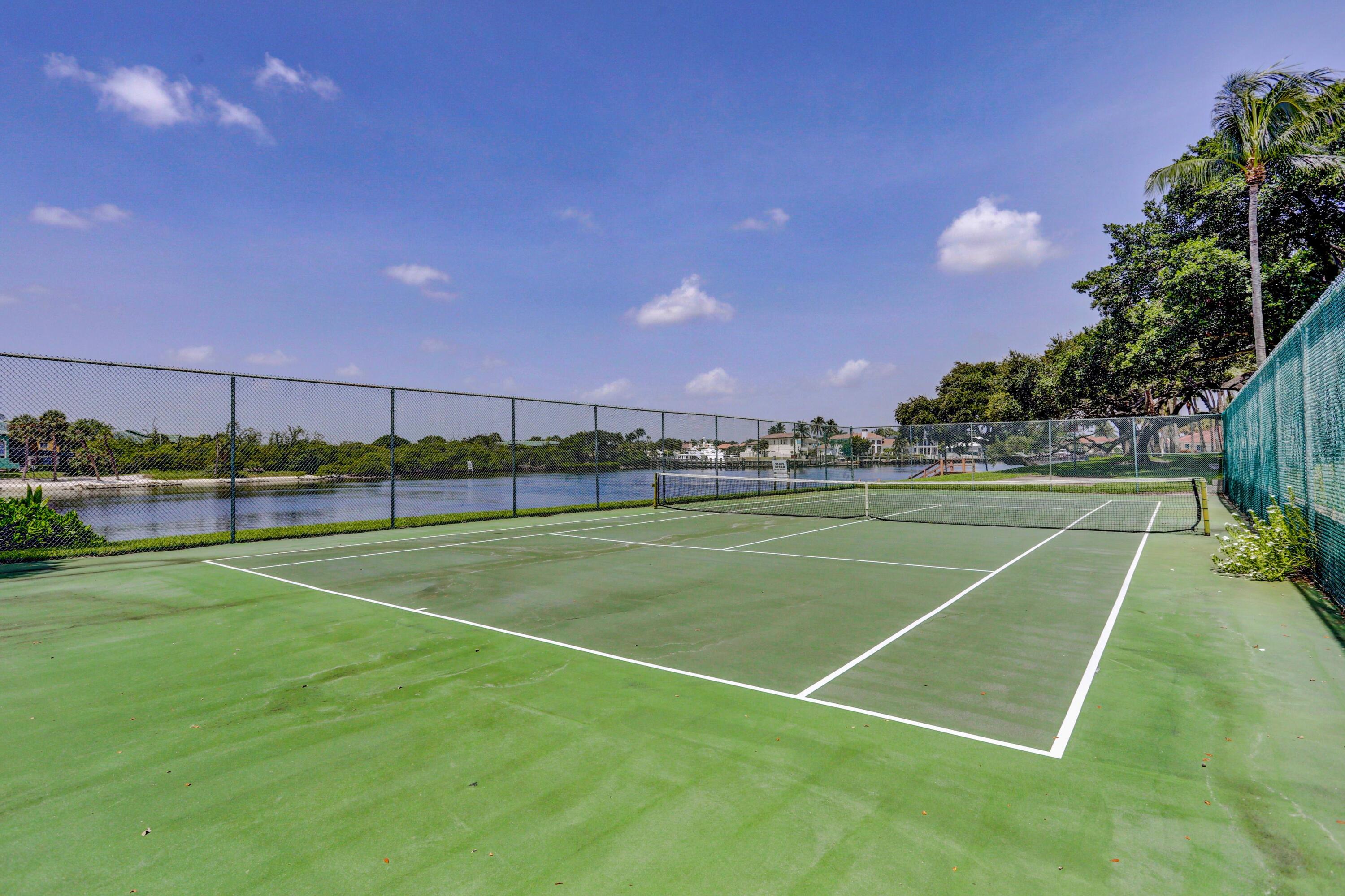 394 Golfview Road, Unit F North Palm Beach, FL 33408 - Photo 56 of 73 a view of an outdoor space and tennis court