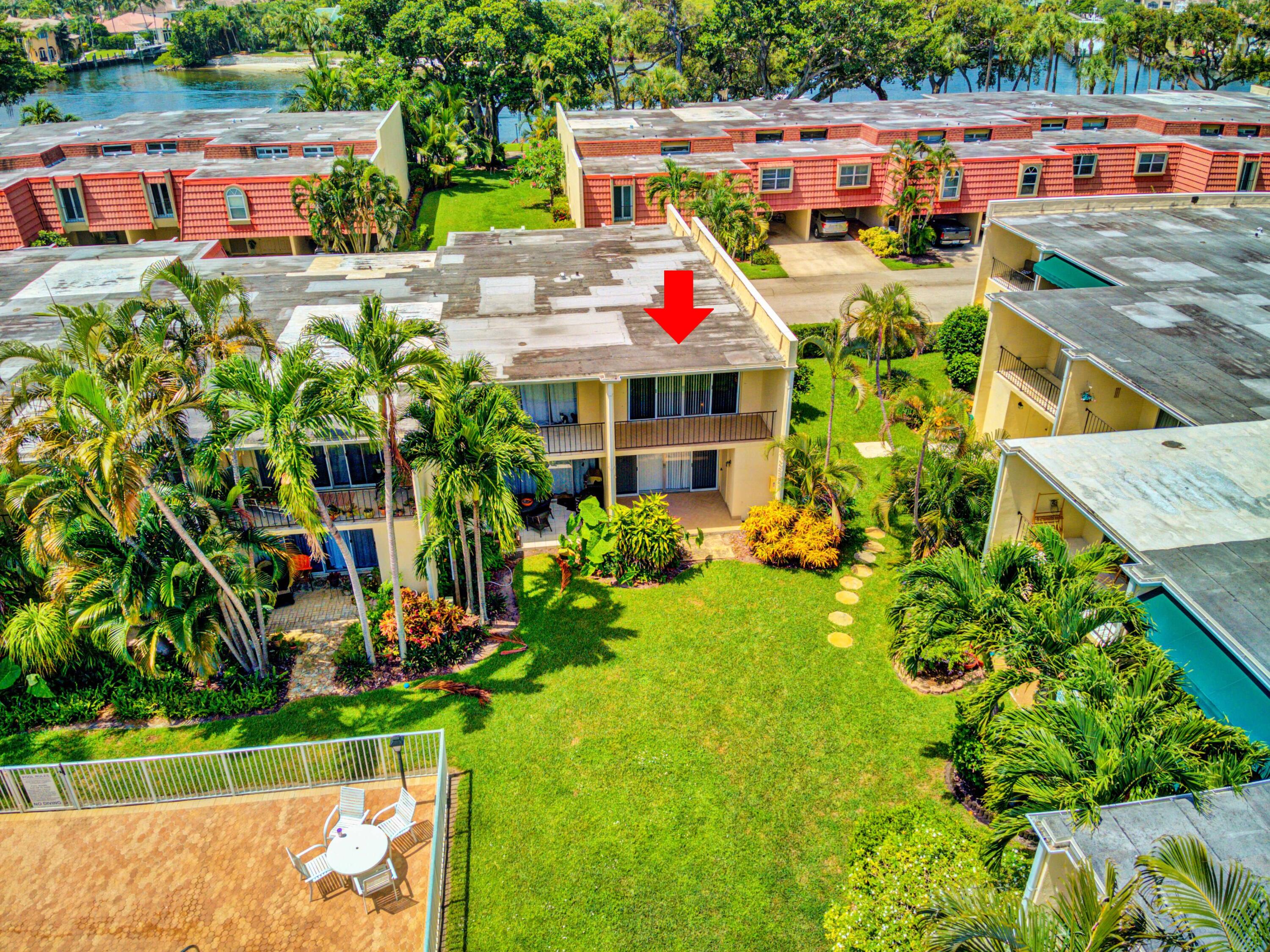 394 Golfview Road, Unit F North Palm Beach, FL 33408 - Photo 70 of 73 a view of swimming pool with a patio and plants