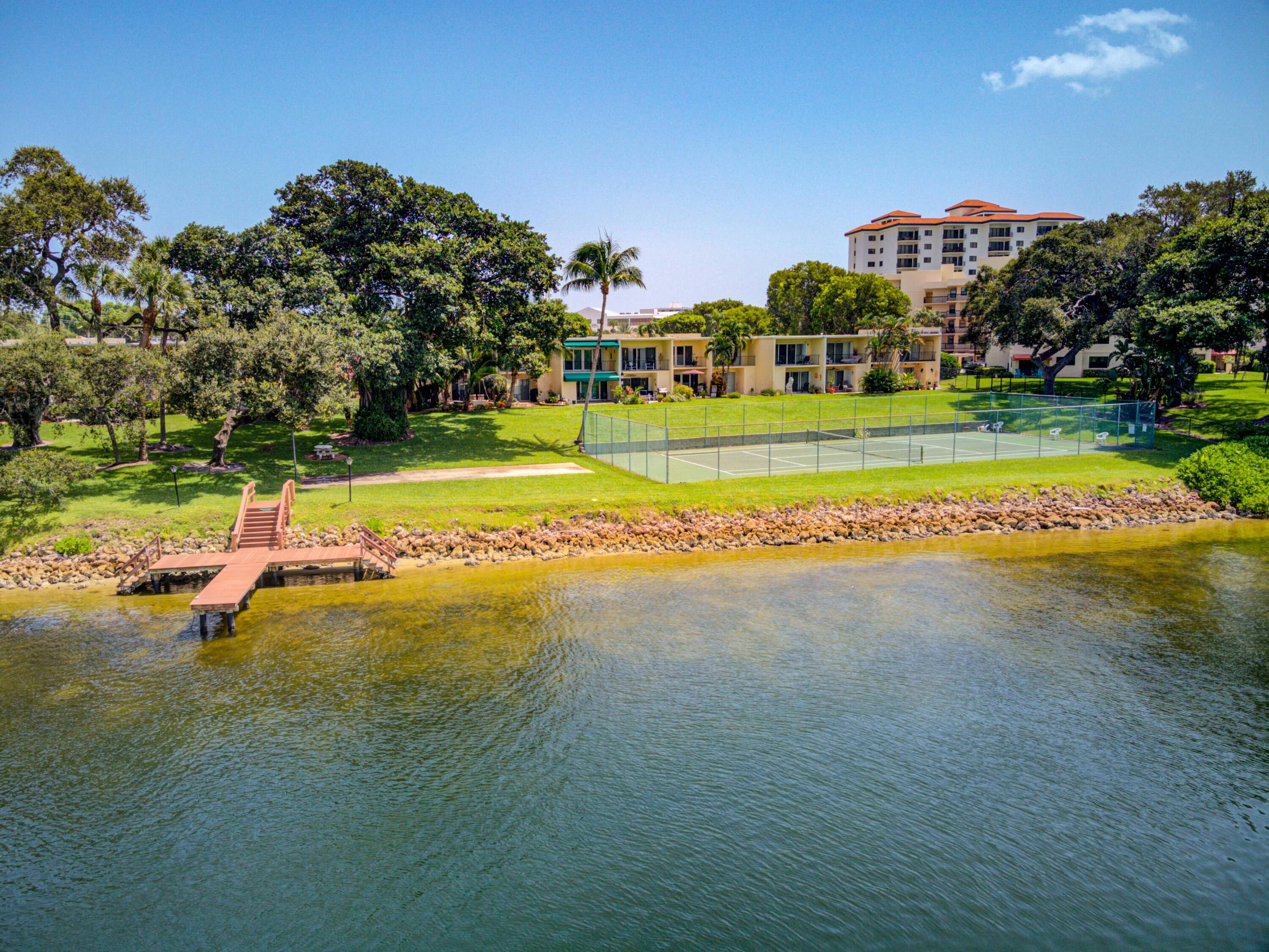 394 Golfview Road, Unit F North Palm Beach, FL 33408 - Photo 72 of 73 a view of a house with a big yard