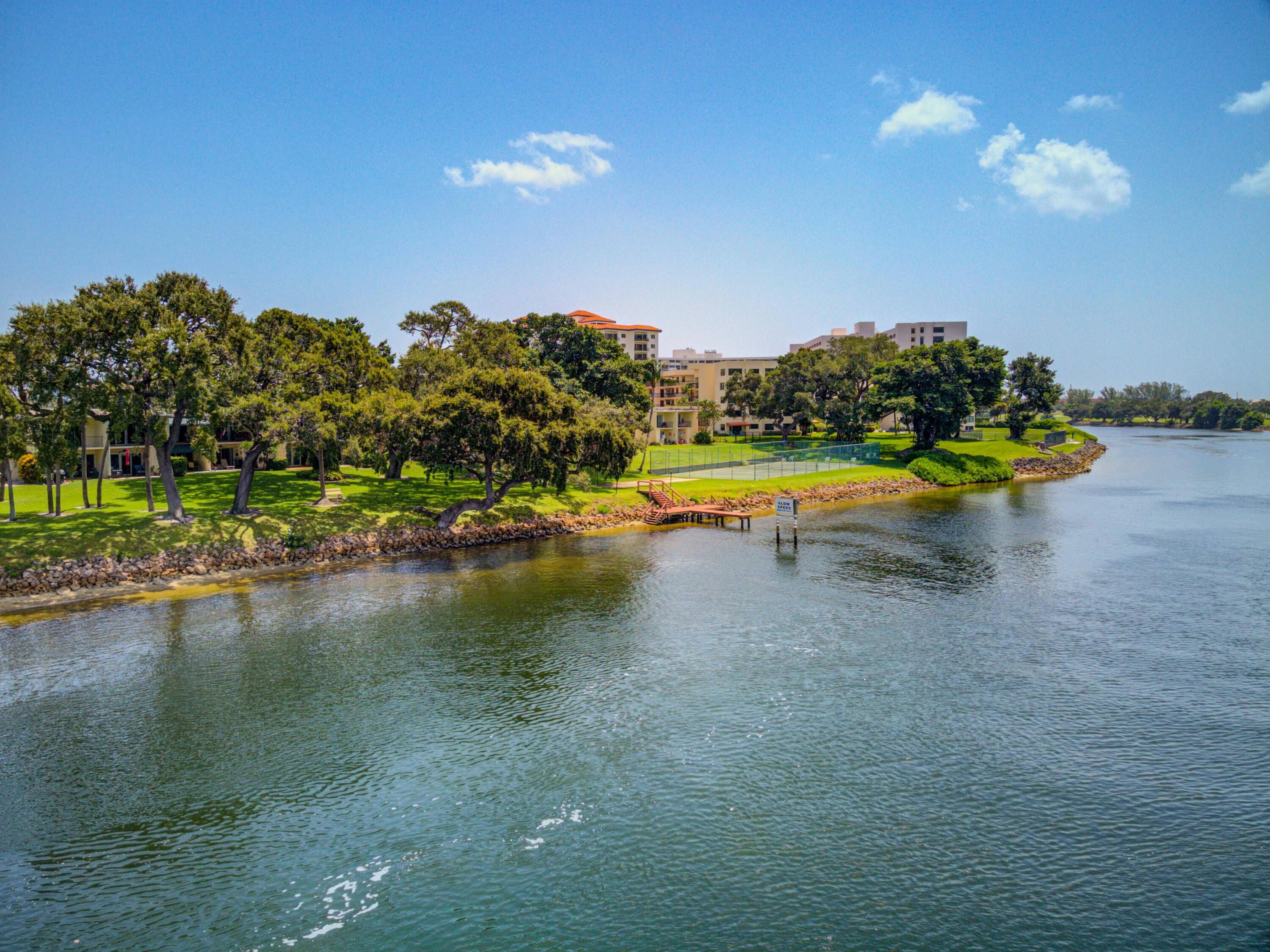 394 Golfview Road, Unit F North Palm Beach, FL 33408 - Photo 73 of 73 a view of a lake with a yard