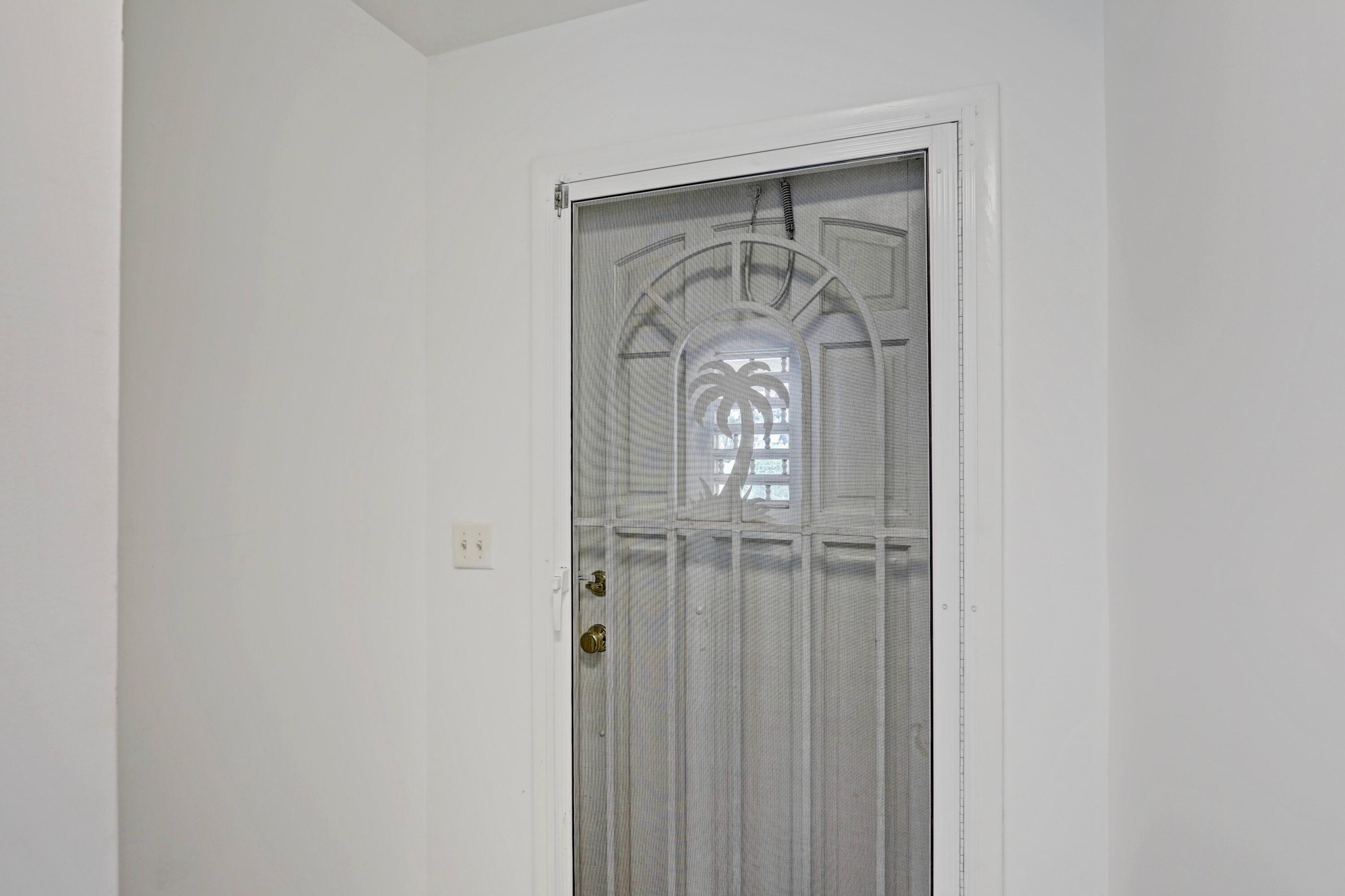 394 Golfview Road, Unit F North Palm Beach, FL 33408 - Photo 8 of 73 a view of front door door