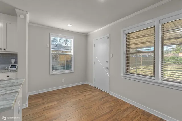 a kitchen with granite countertop a stove and a refrigerator