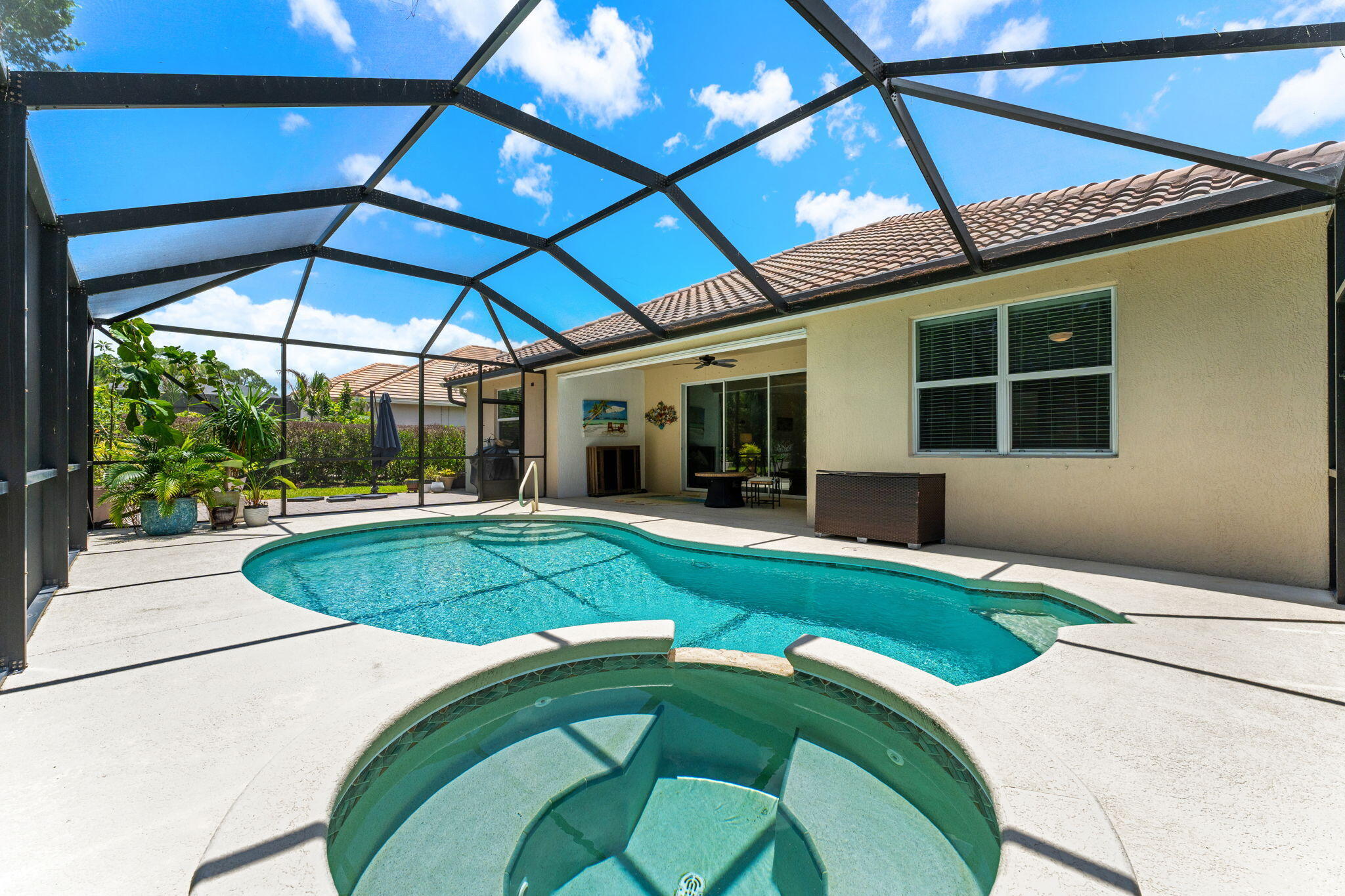7657 Fieldstone Ranch Square Vero Beach, FL 32967 - Photo 39 of 52 a house with swimming pool in front of it