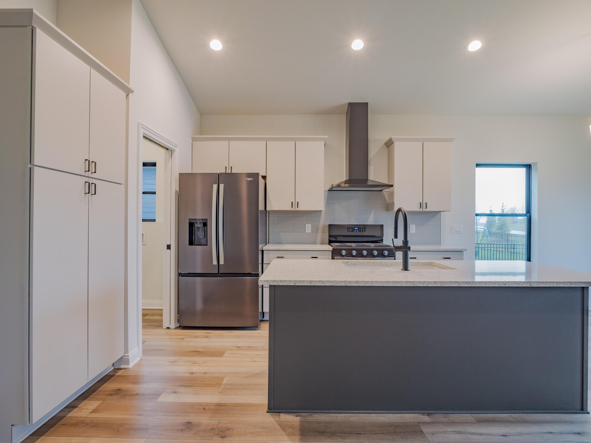 3004 Forestside Lane Valparaiso, IN 46385 - Photo 11 of 23 a large kitchen with stainless steel appliances a refrigerator and a stove top oven