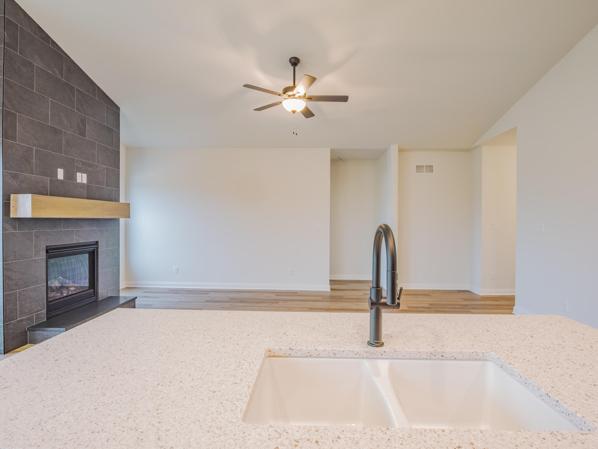 3004 Forestside Lane Valparaiso, IN 46385 - Photo 14 of 23 a view of a kitchen with a sink and a fireplace