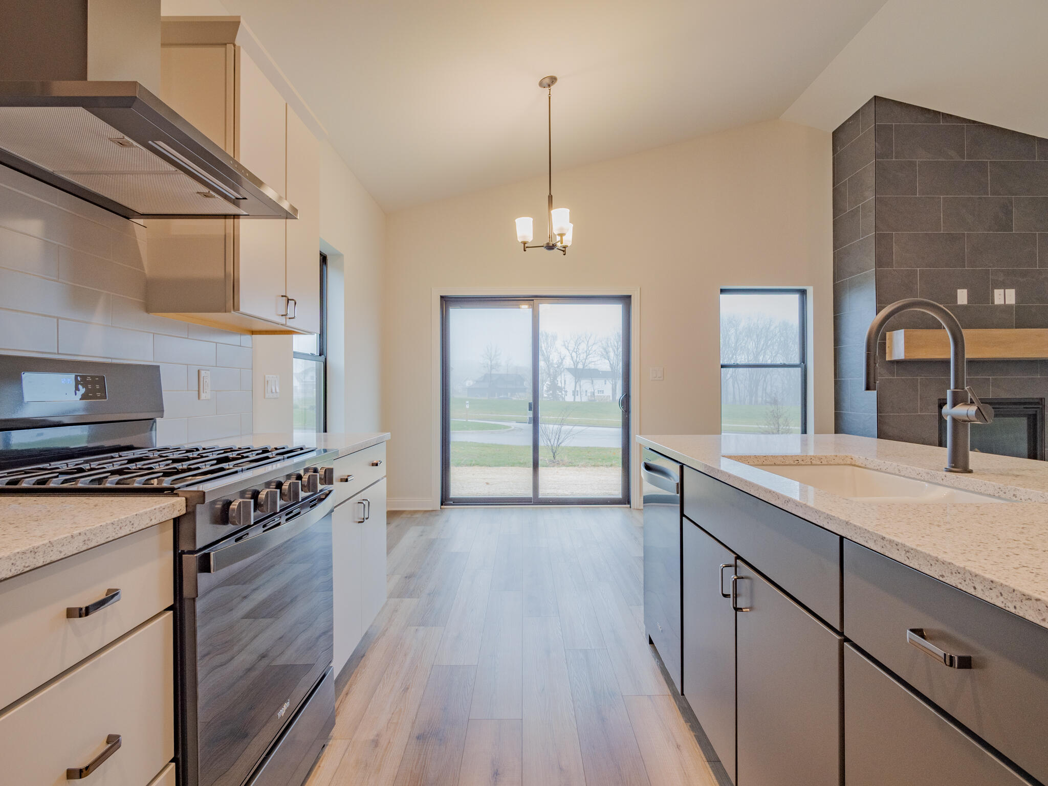 3004 Forestside Lane Valparaiso, IN 46385 - Photo 15 of 23 a kitchen with granite countertop a stove and a sink