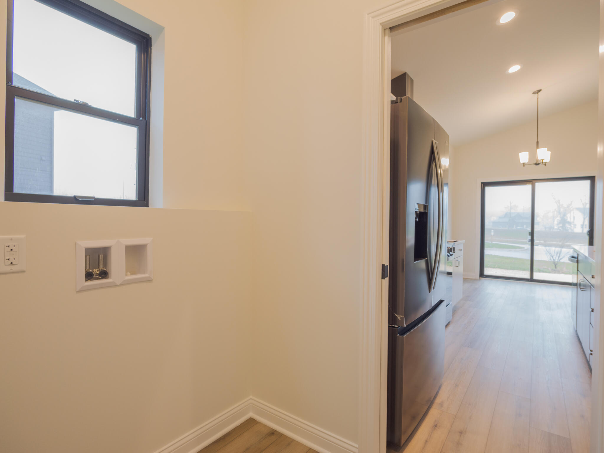 3004 Forestside Lane Valparaiso, IN 46385 - Photo 17 of 23 a view of a hallway with wooden floor and a bathroom