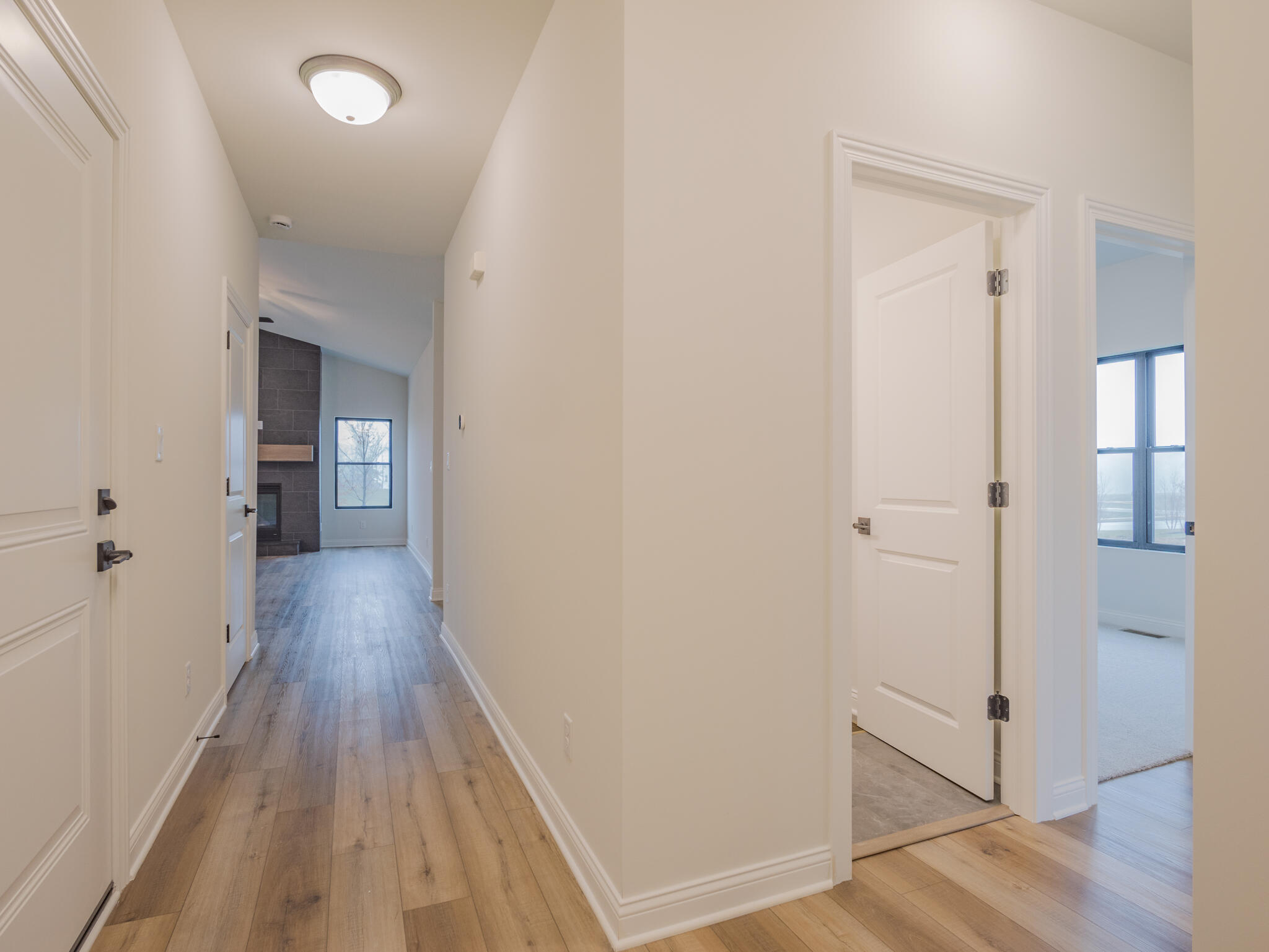 3004 Forestside Lane Valparaiso, IN 46385 - Photo 3 of 23 a view of a hallway with wooden floor