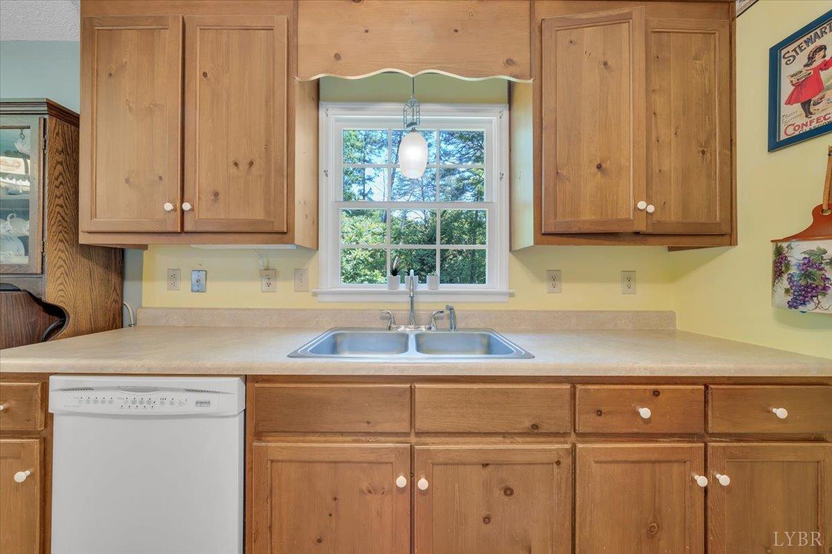 1124 Homeplace Road Bedford, VA 24523 - Photo 14 of 47 a kitchen with a sink cabinets and window