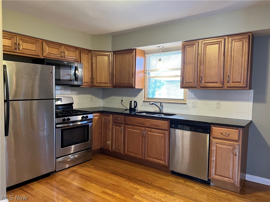 6916 York Road Parma Heights, OH 44130 - Photo 4 of 17 Updated Kitchen, Granite Top, Stainless Steel Appliances, Subway Tile Back Splash