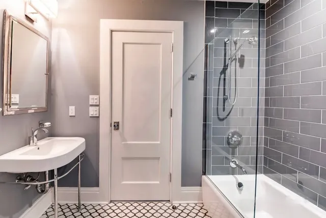 a bedroom with furniture and wooden floor