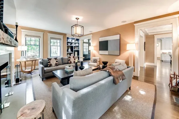 a living room with furniture fireplace and a flat screen tv