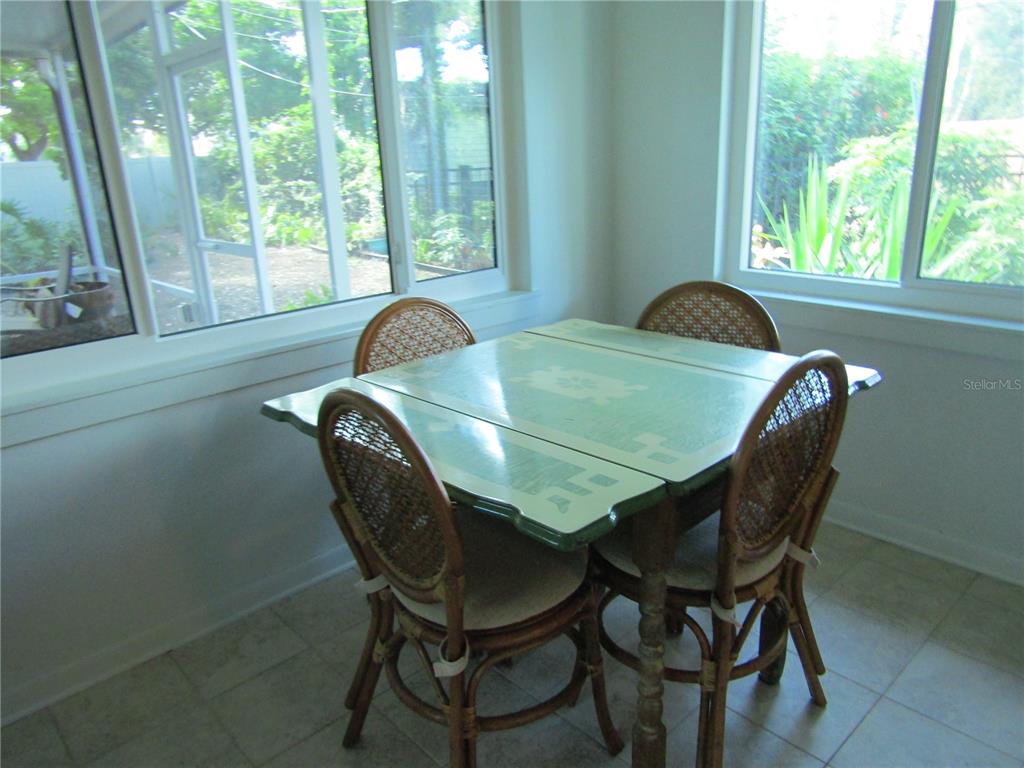421 Riviera Street Venice, FL 34285 - Photo 16 of 31 a dining room with furniture and wooden floor