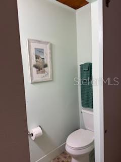 421 Riviera Street Venice, FL 34285 - Photo 18 of 31 a white toilet sitting next to a bathroom sink