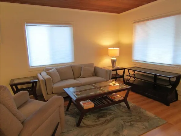 a living room with furniture and a window