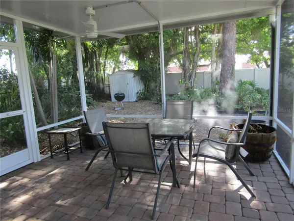 a outdoor dining space with furniture and garden view