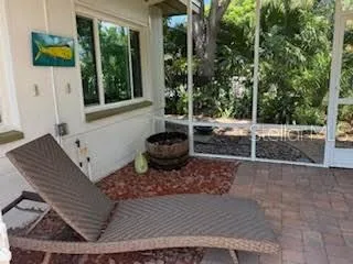 a view of a backyard with sitting area