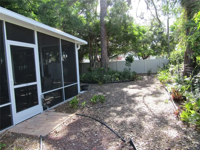 a backyard of a house with lots of green space