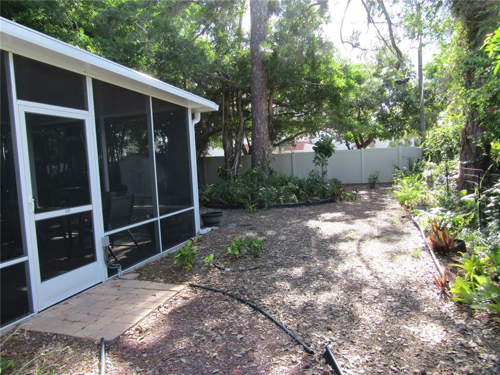421 Riviera Street Venice, FL 34285 - Photo 30 of 31 a backyard of a house with lots of green space
