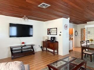 421 Riviera Street Venice, FL 34285 - Photo 4 of 31 a living room with furniture and a flat screen tv