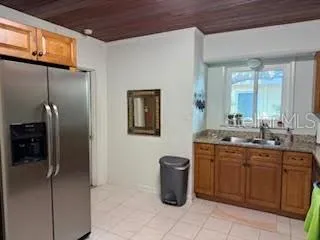 a spacious bathroom with a granite countertop sink a mirror and a shower