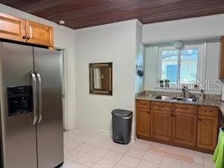 421 Riviera Street Venice, FL 34285 - Photo 9 of 31 a spacious bathroom with a granite countertop sink a mirror and a shower