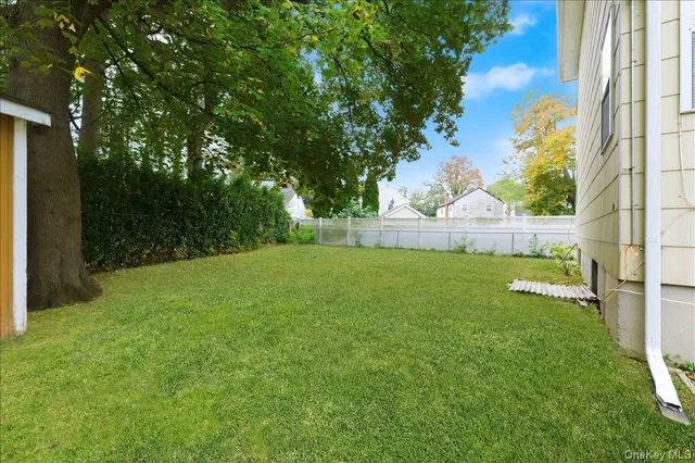 a view of backyard with trampoline
