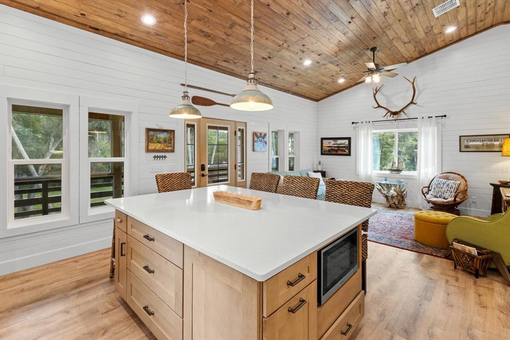 5328 Riverside Drive Yankeetown, FL 34498 - Photo 15 of 46 a view of a dining room with furniture window and wooden floor