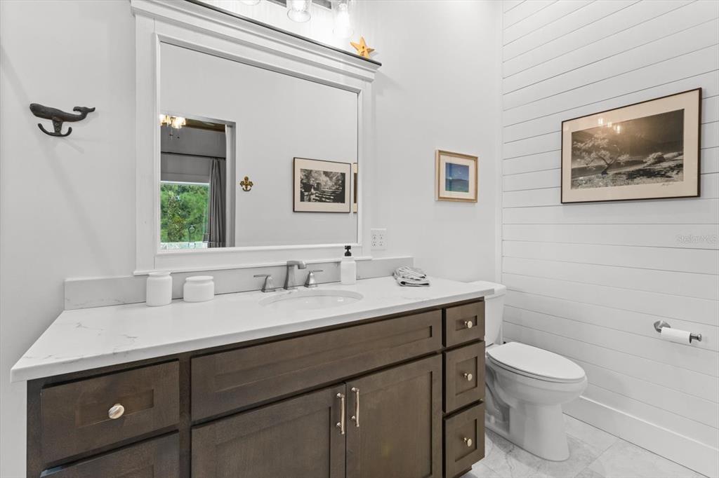 5328 Riverside Drive Yankeetown, FL 34498 - Photo 19 of 46 a bathroom with a toilet sink and mirror