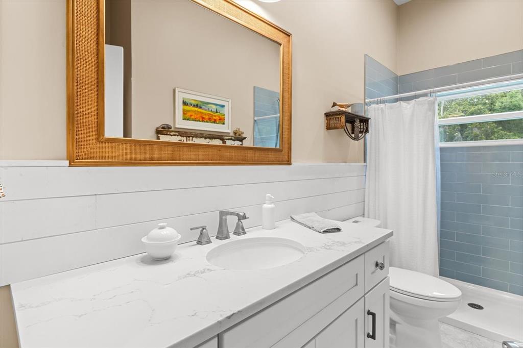 5328 Riverside Drive Yankeetown, FL 34498 - Photo 24 of 46 a bathroom with a sink a toilet and a mirror