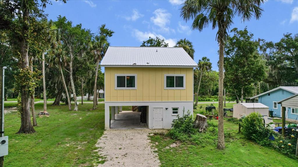 5328 Riverside Drive Yankeetown, FL 34498 - Photo 29 of 46 a view of a house with a backyard