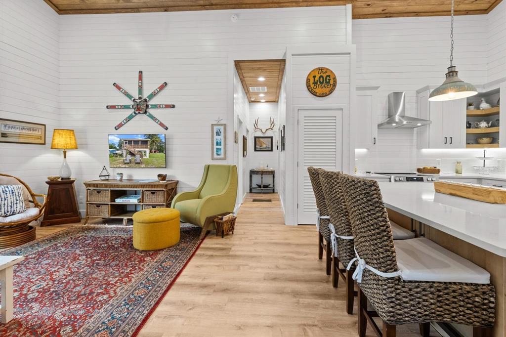 5328 Riverside Drive Yankeetown, FL 34498 - Photo 8 of 46 a living room with furniture a rug and wall paintings