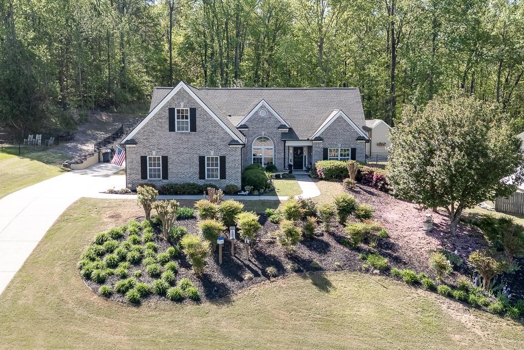 320 Arbor Rd S West Monroe, GA 30656 - Photo 1 of 1 a view of a house with a big yard and large trees
