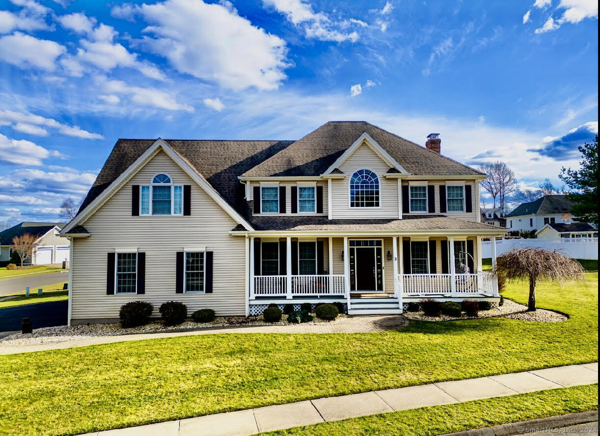 a view of a house with swimming pool and sitting area