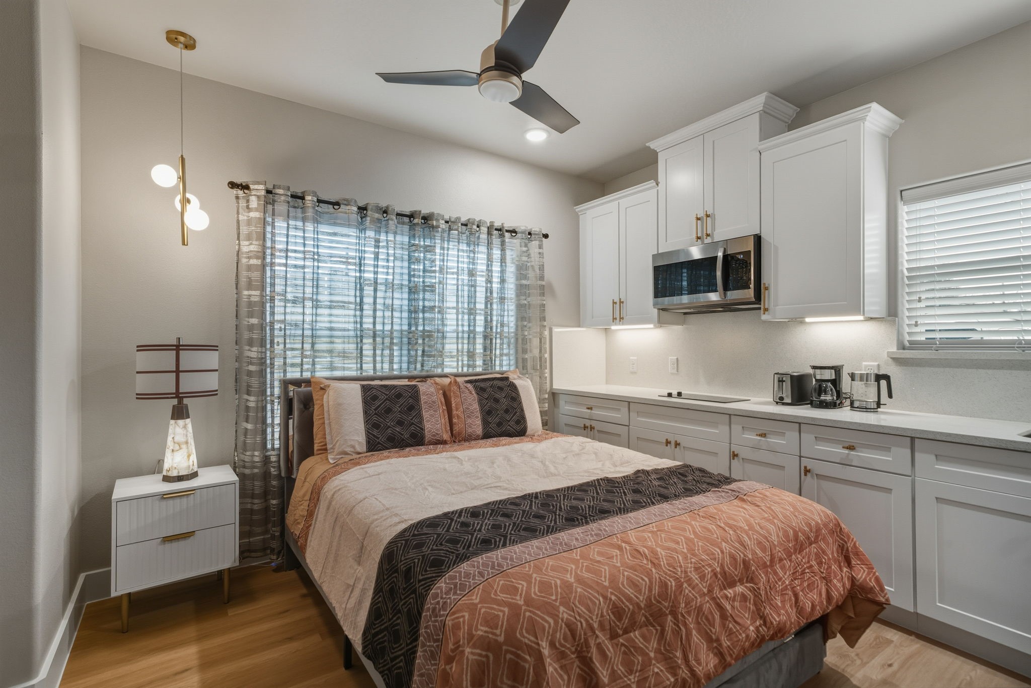 a bed room with a bed and a television