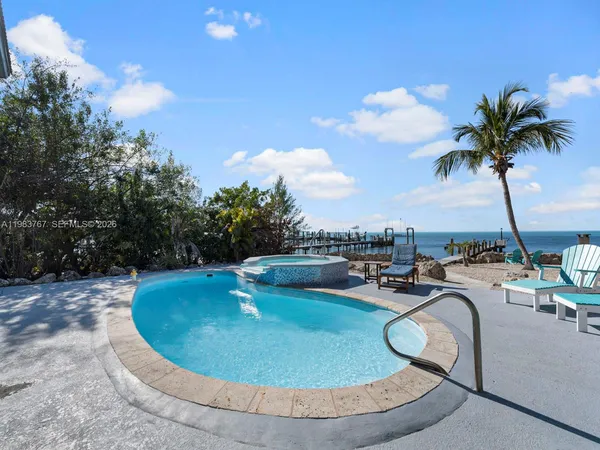 a view of a swimming pool with a patio