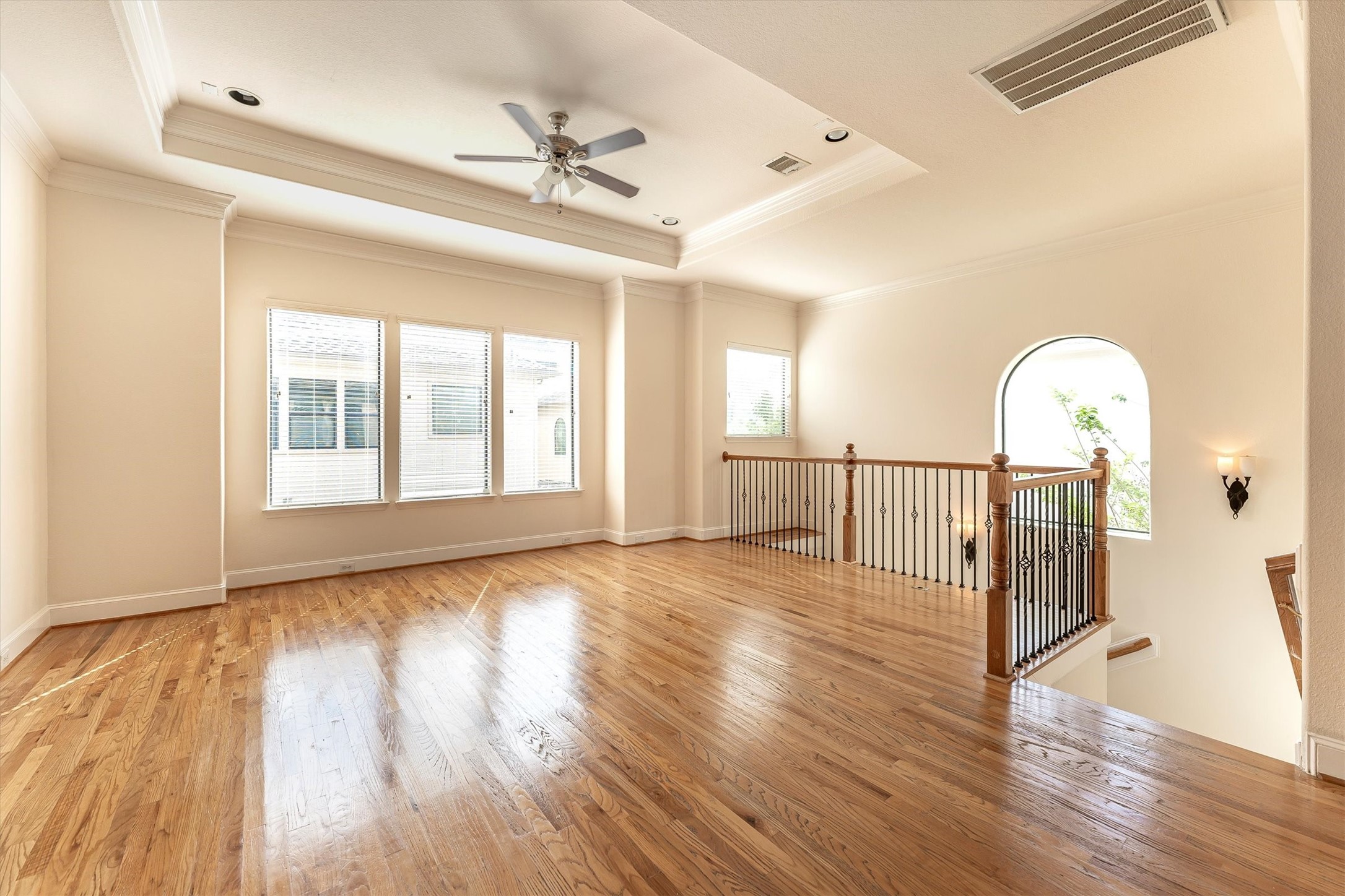 308 Grove Street Houston, TX 77020 - Photo 7 of 28 a view of an empty room with wooden floor and a window