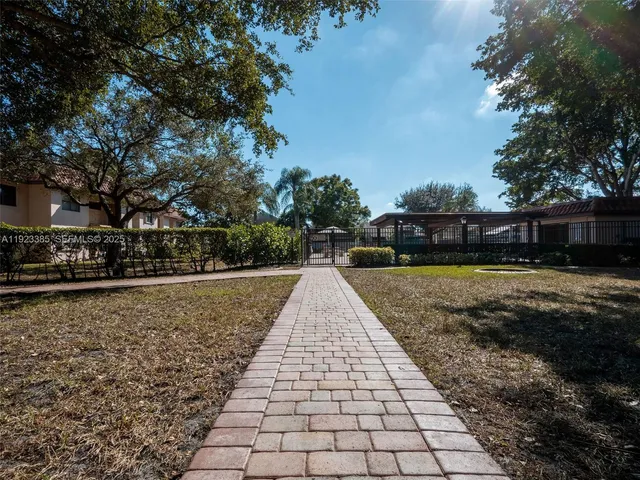a view of park with large trees