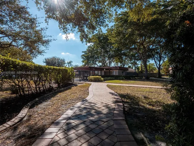 a view of swimming pool with trees in the background