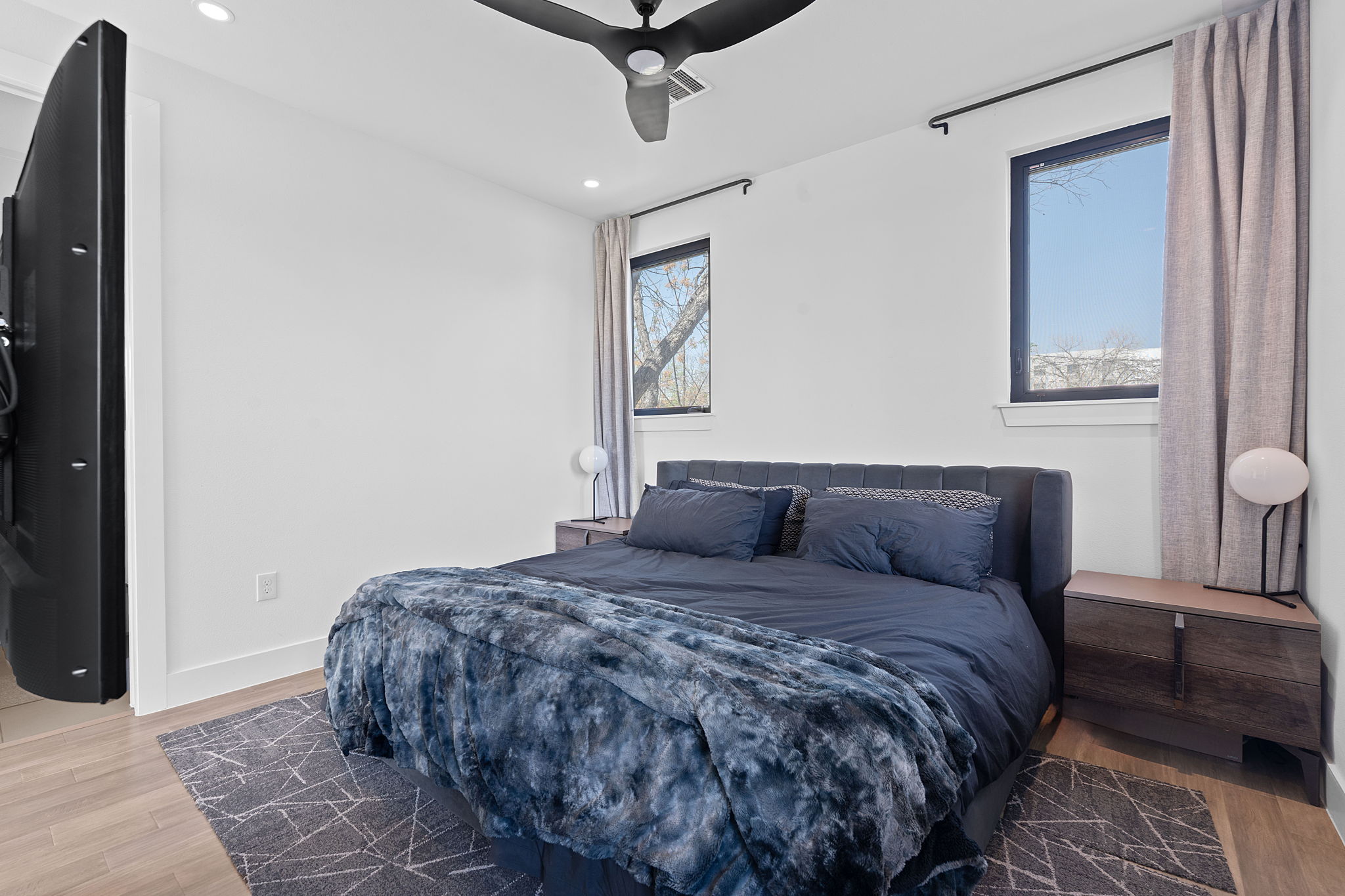 308 Onion Street Austin, TX 78702 - Photo 20 of 40 a bedroom with a large bed and a window