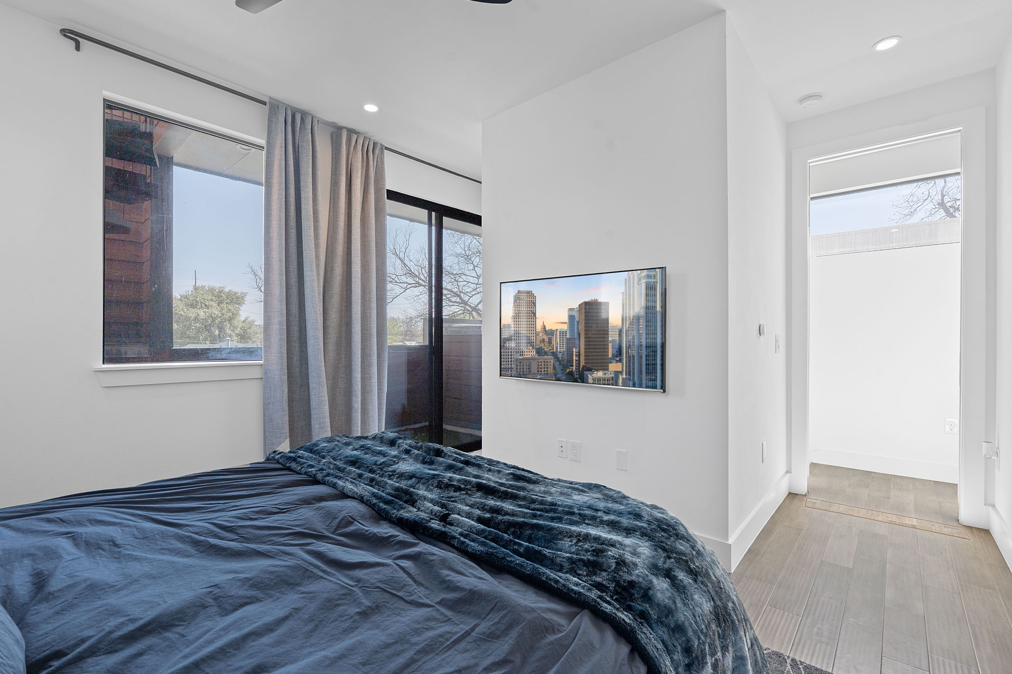 308 Onion Street Austin, TX 78702 - Photo 23 of 40 a bedroom with a bed and a window