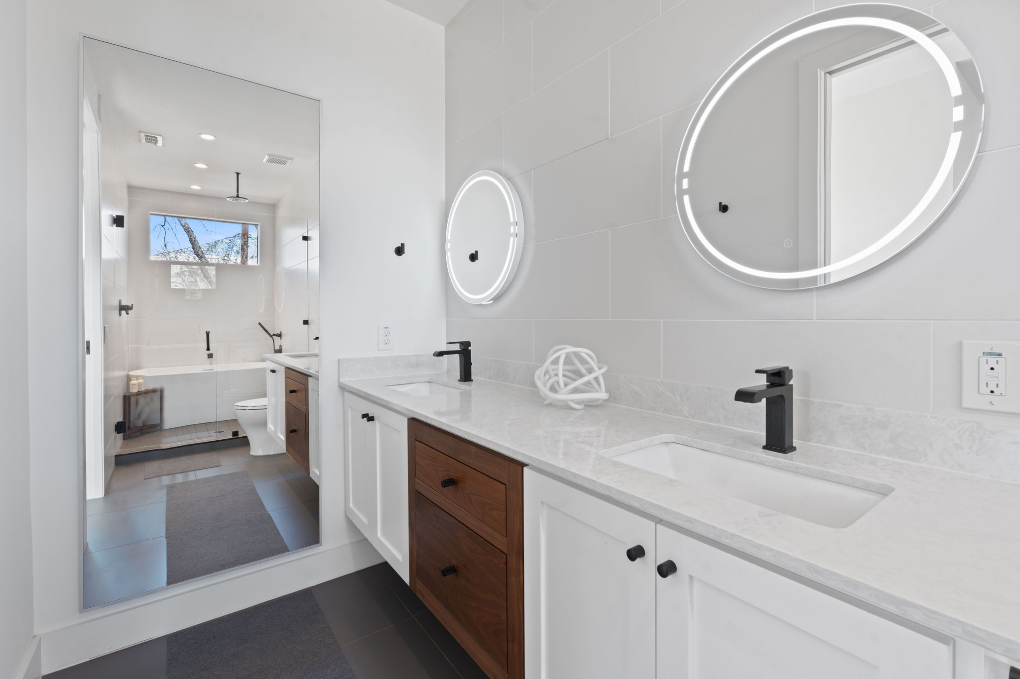 308 Onion Street Austin, TX 78702 - Photo 24 of 40 a bathroom with a double vanity sink and a mirror