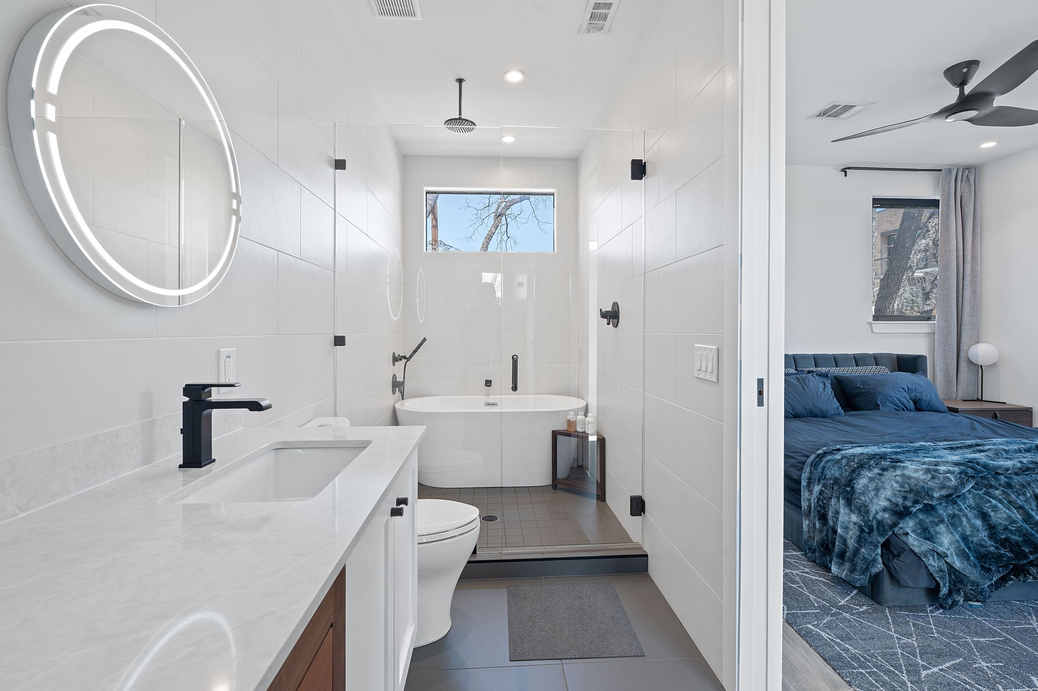 308 Onion Street Austin, TX 78702 - Photo 25 of 40 a en suite bathroom with a double vanity sink and a mirror