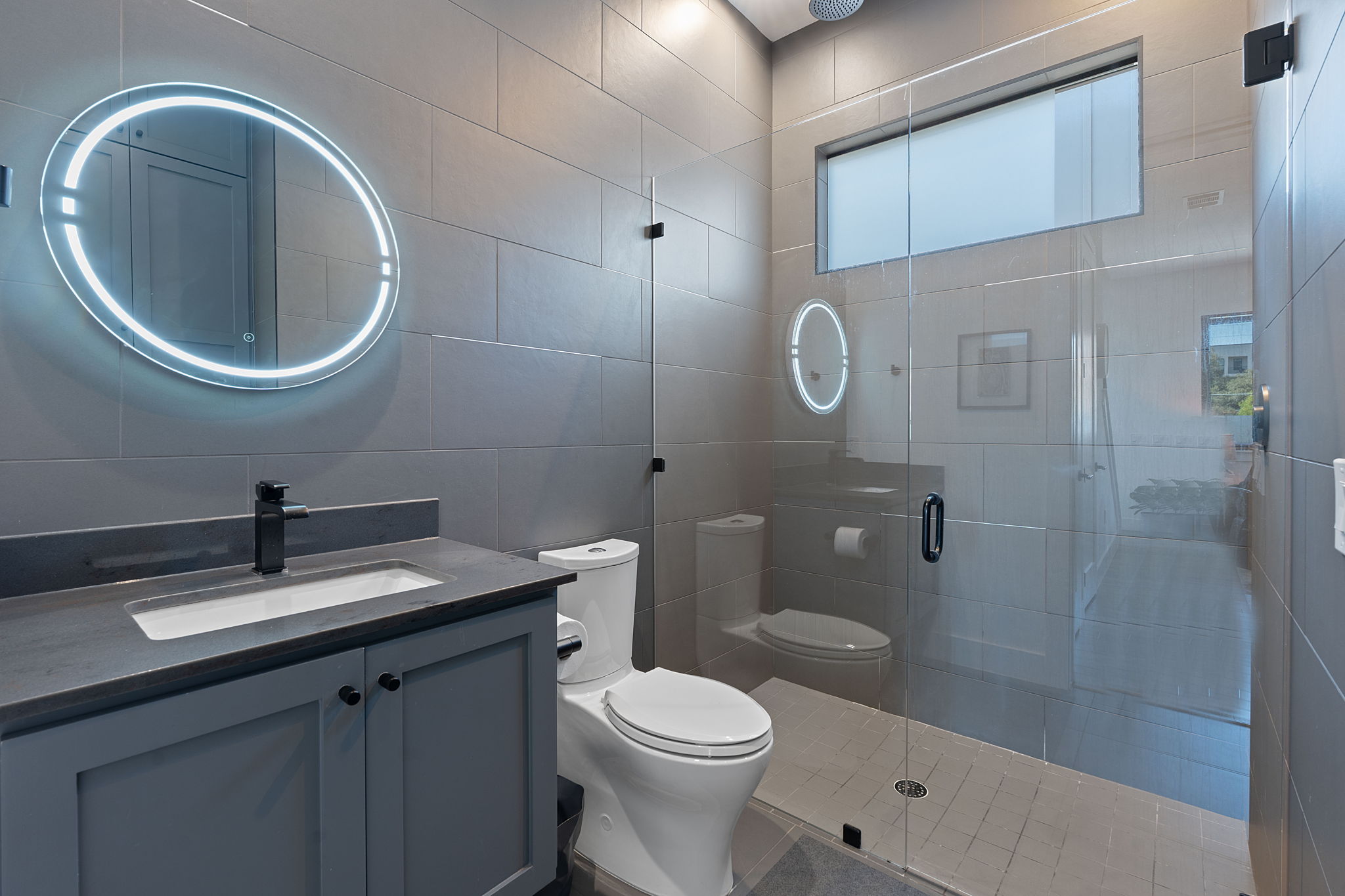 308 Onion Street Austin, TX 78702 - Photo 30 of 40 a bathroom with a sink a toilet and shower
