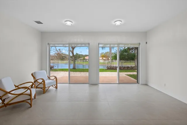 a view of an empty room with glass door