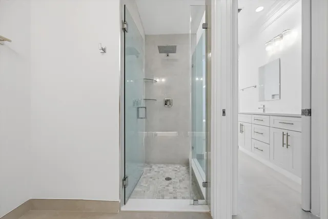 an empty room with chandelier fan