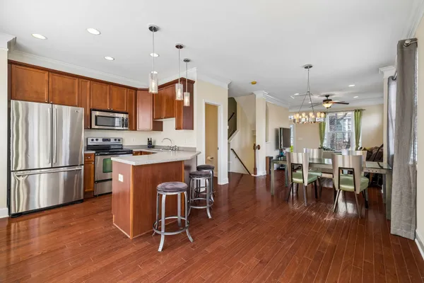 a view of a dining room with furniture window and wooden floor